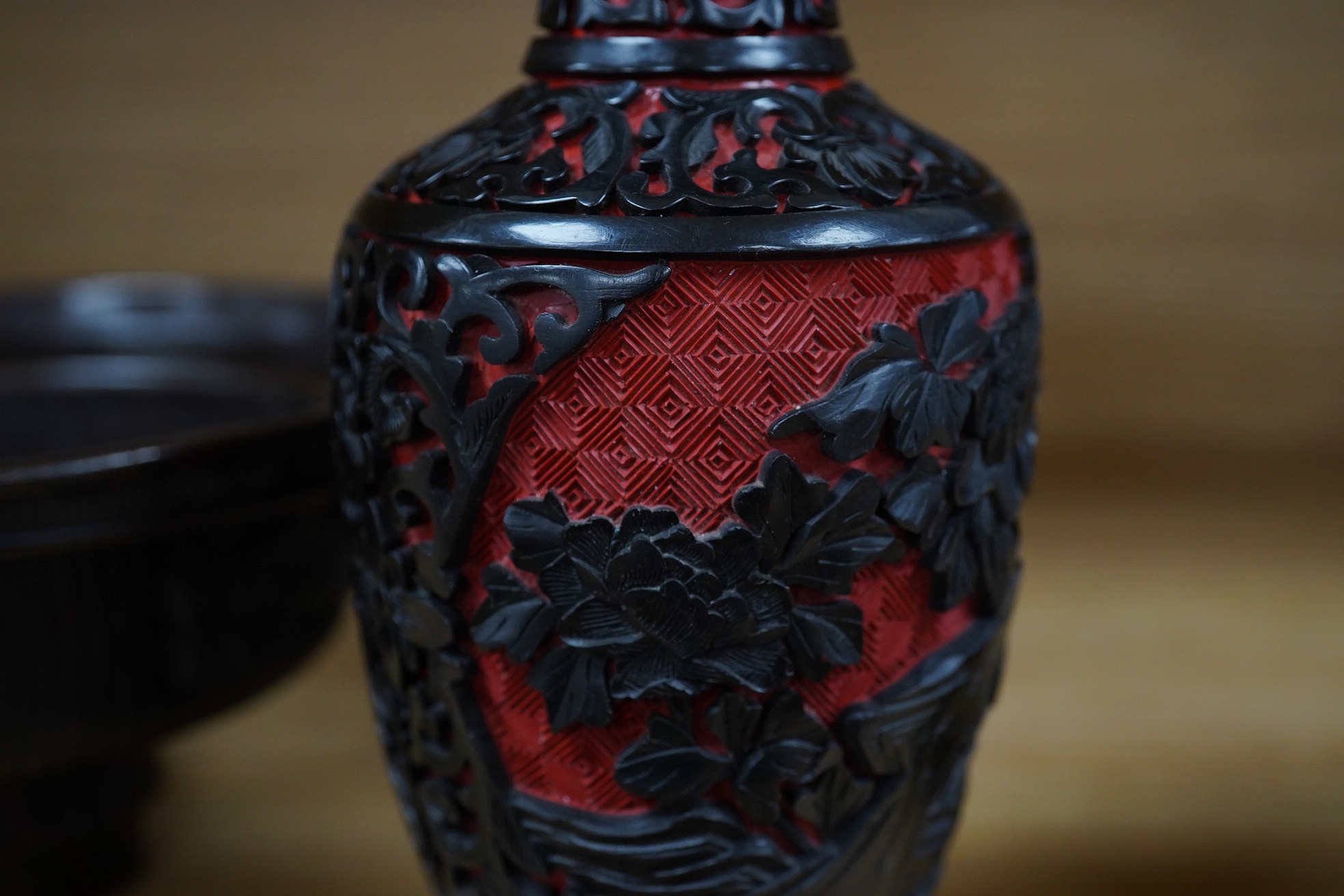 A Chinese bronze bowl, 17cm diameter, a lacquer vase, 15cm high, and a Chinese hand mirror with ivory inlay (3). CITES Submission reference 1UK5HNLM. Condition - fair to good